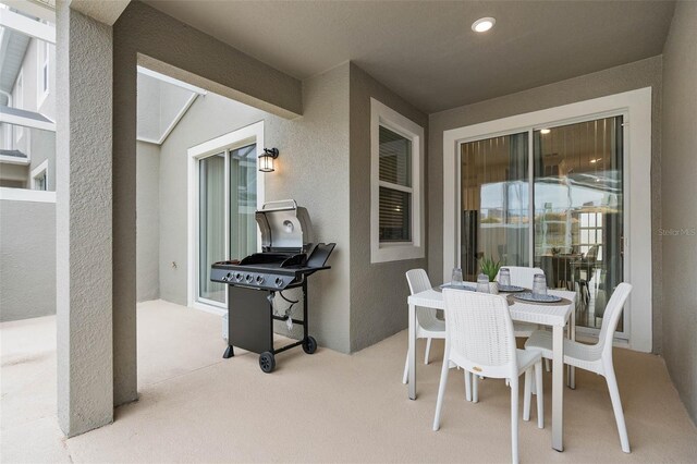 view of patio / terrace featuring area for grilling and outdoor dining space