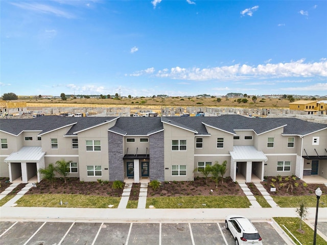 exterior space with a residential view and uncovered parking