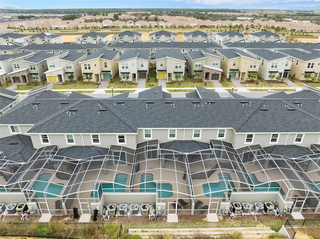 birds eye view of property with a residential view