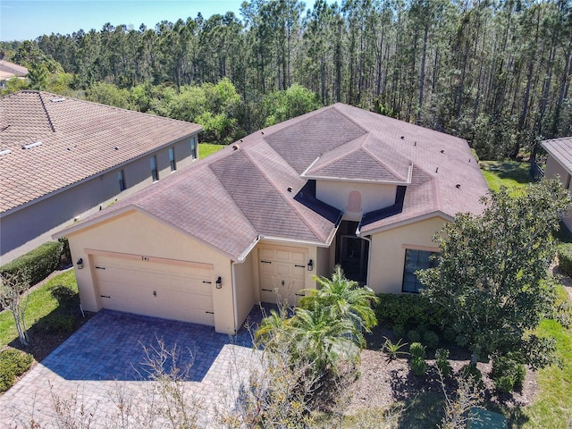 drone / aerial view with a view of trees