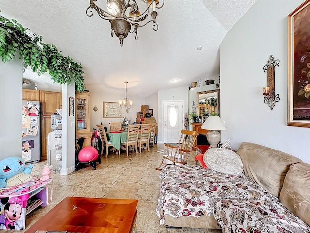 living area with baseboards, a chandelier, a textured ceiling, and light tile patterned flooring