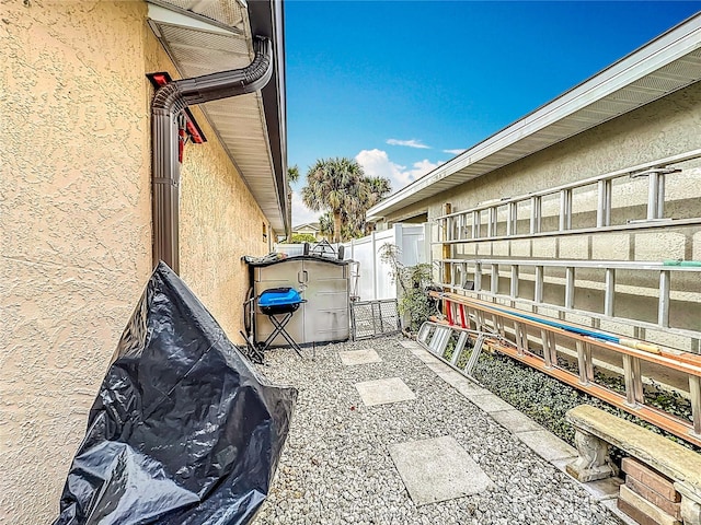 view of patio / terrace with fence and a gate