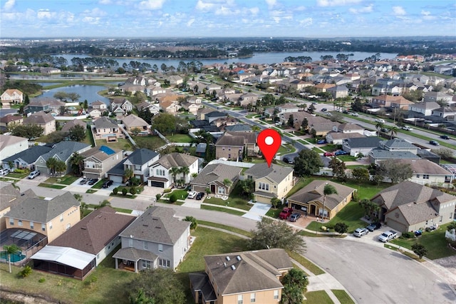 aerial view featuring a water view and a residential view