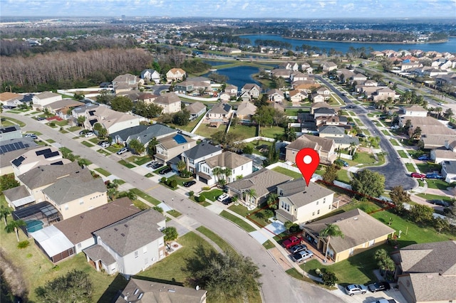 bird's eye view with a water view and a residential view