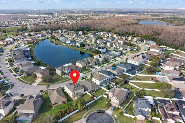 bird's eye view with a water view and a residential view