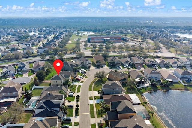 bird's eye view featuring a water view and a residential view