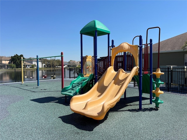 communal playground featuring fence