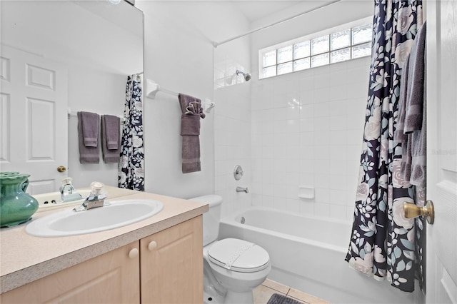 bathroom featuring shower / bath combo, vanity, and toilet