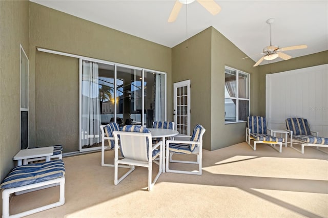 view of patio with a ceiling fan and outdoor dining area