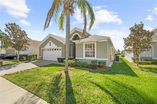 view of front of house featuring an attached garage, central AC, driveway, stucco siding, and a front yard