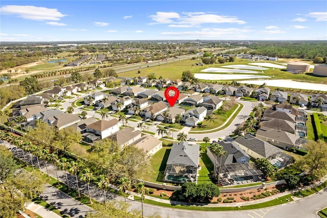 bird's eye view with a residential view and a water view