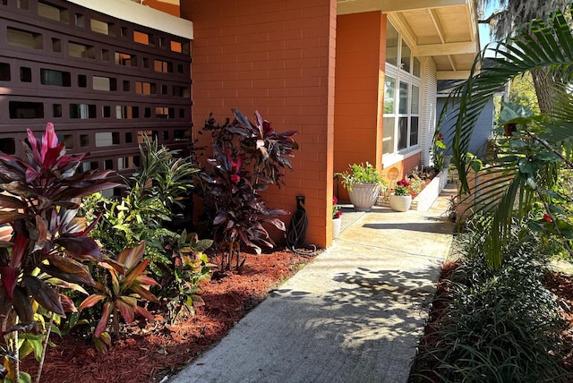 view of side of home with concrete block siding