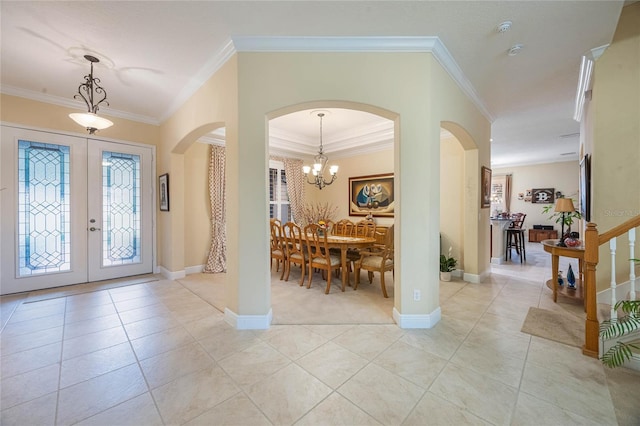 1686 Shadowmoss Cir, Lake Mary, FL 32746 - entrance foyer with arched walkways, ornamental molding, healthy amount of natural light, and light tile patterned floors