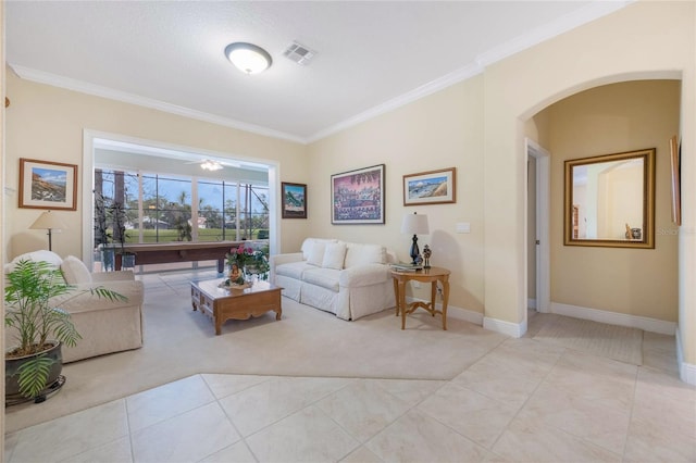 1686 Shadowmoss Cir, Lake Mary, FL 32746 - living room featuring arched walkways, light carpet, ornamental molding, light tile patterned floors, and baseboards