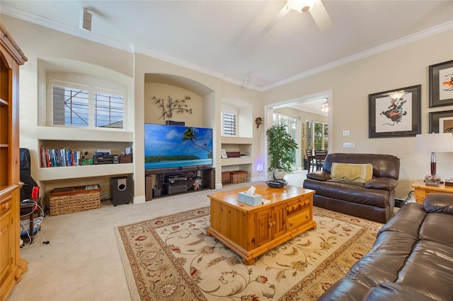 1686 Shadowmoss Cir, Lake Mary, FL 32746 - living area with crown molding, light carpet, a ceiling fan, and built in features