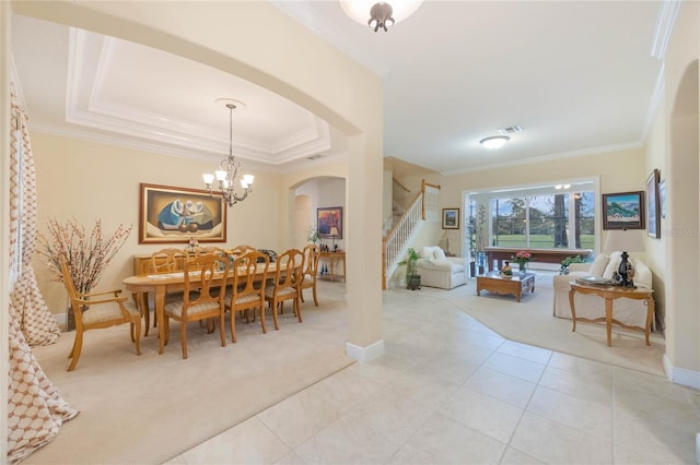 1686 Shadowmoss Cir, Lake Mary, FL 32746 - dining room featuring light colored carpet, arched walkways, stairway, baseboards, and crown molding