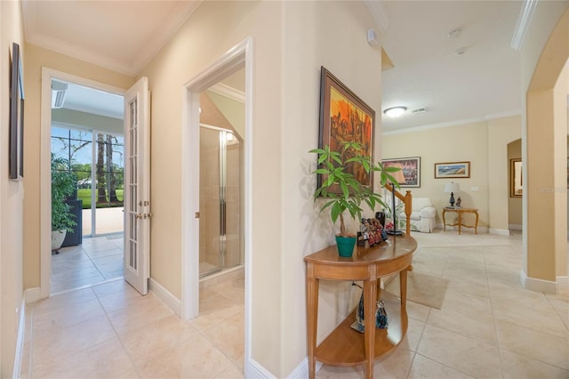 1686 Shadowmoss Cir, Lake Mary, FL 32746 - hall featuring crown molding, light tile patterned floors, arched walkways, and baseboards