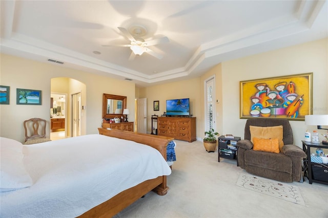 1686 Shadowmoss Cir, Lake Mary, FL 32746 - carpeted bedroom with a tray ceiling, arched walkways, a ceiling fan, and connected bathroom