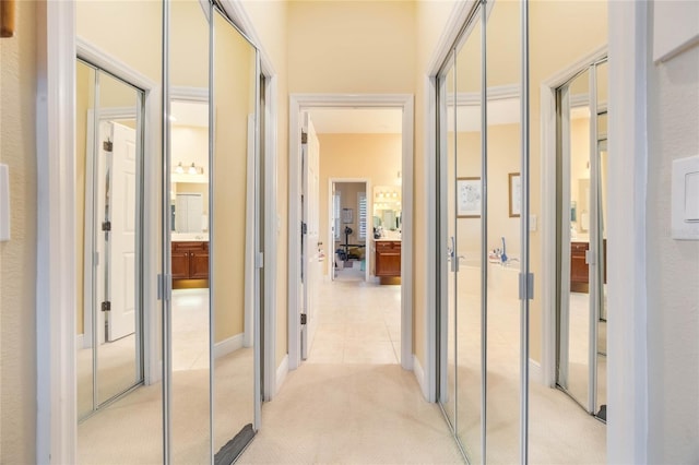 1686 Shadowmoss Cir, Lake Mary, FL 32746 - hallway featuring light carpet and baseboards