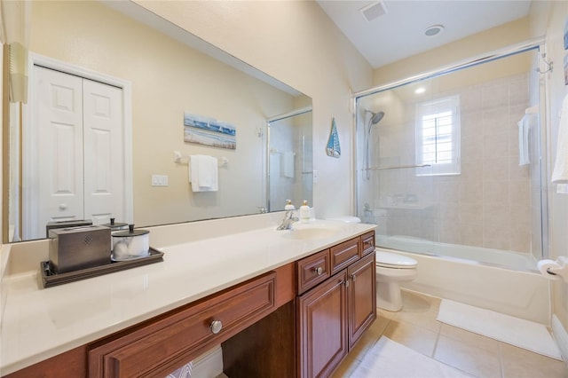 1686 Shadowmoss Cir, Lake Mary, FL 32746 - full bath with toilet, vanity, tile patterned flooring, and shower / bath combination with glass door