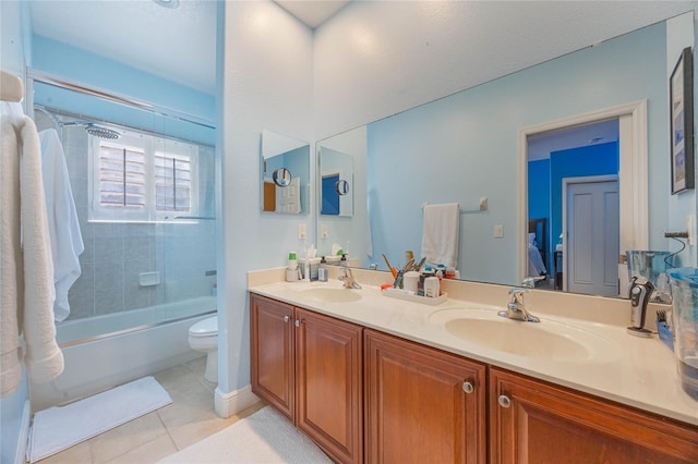 1686 Shadowmoss Cir, Lake Mary, FL 32746 - full bath with tile patterned flooring, double vanity, toilet, and combined bath / shower with glass door