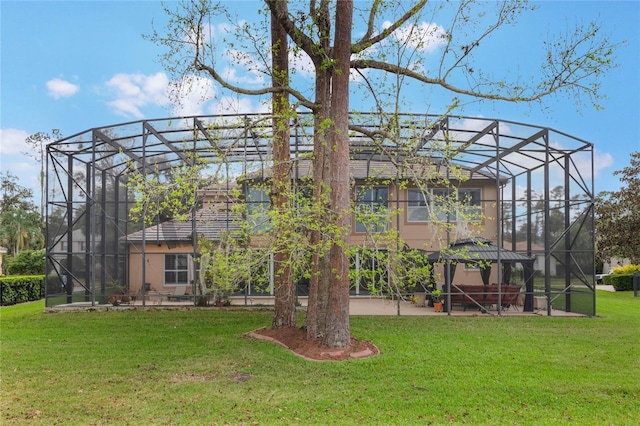 1686 Shadowmoss Cir, Lake Mary, FL 32746 - rear view of property with glass enclosure, a lawn, and a patio area