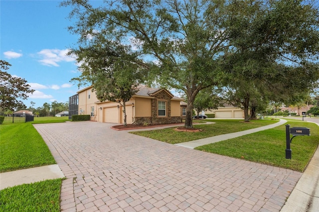 1686 Shadowmoss Cir, Lake Mary, FL 32746 - view of front facade with stone siding, stucco siding, decorative driveway, and a front yard