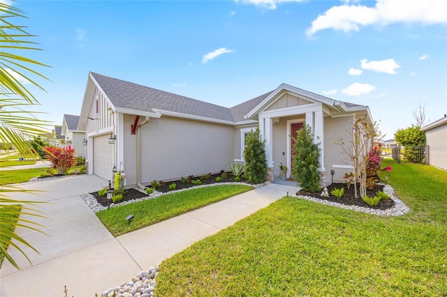 view of front of house featuring concrete driveway, a front lawn, board and batten siding, and an attached garage