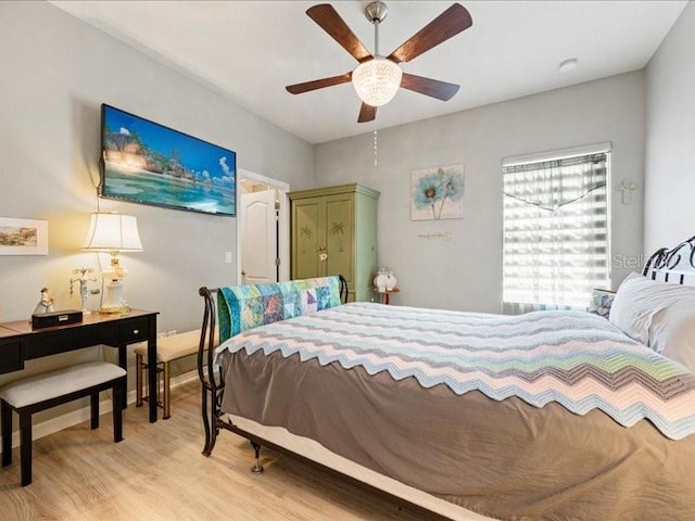 bedroom featuring a ceiling fan and light wood-style floors