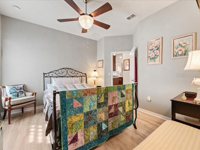 bedroom with a ceiling fan, visible vents, light wood-style flooring, and baseboards