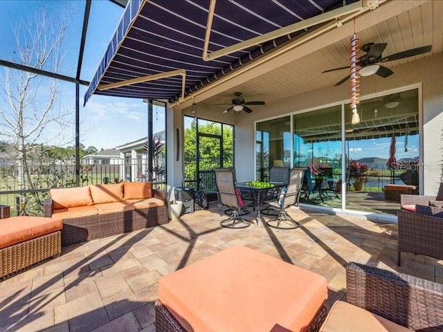 view of patio / terrace with an outdoor hangout area, ceiling fan, and outdoor dining area