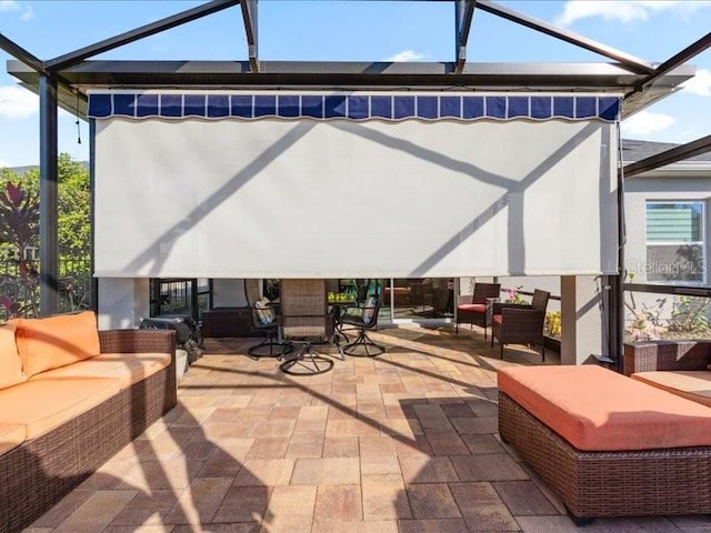 view of patio featuring glass enclosure and an outdoor living space