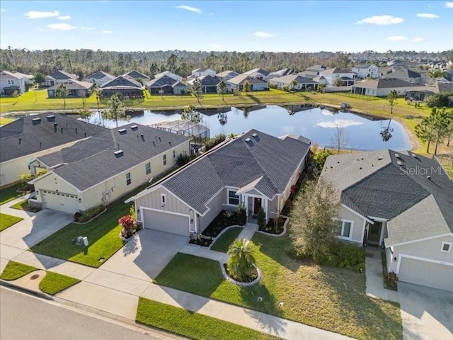 aerial view featuring a water view and a residential view