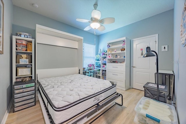 bedroom featuring light wood-style floors and ceiling fan