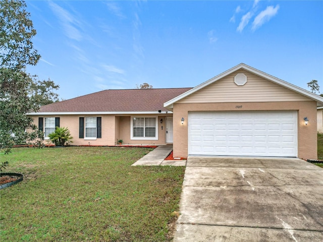 ranch-style home with an attached garage, a shingled roof, driveway, stucco siding, and a front yard