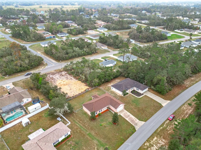 birds eye view of property with a residential view