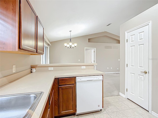 kitchen with white dishwasher, a peninsula, a sink, vaulted ceiling, and an inviting chandelier