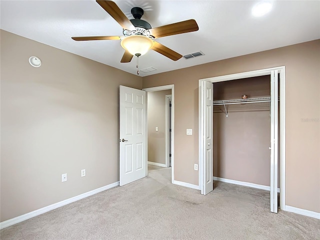 unfurnished bedroom with baseboards, a closet, visible vents, and carpet flooring