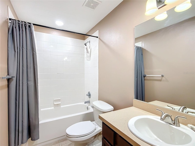 bathroom featuring shower / bath combination with curtain, visible vents, vanity, and toilet