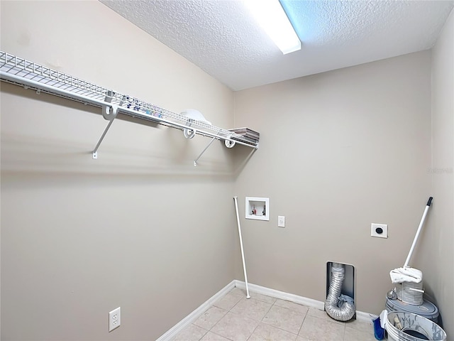 laundry room featuring washer hookup, light tile patterned floors, electric dryer hookup, a textured ceiling, and laundry area