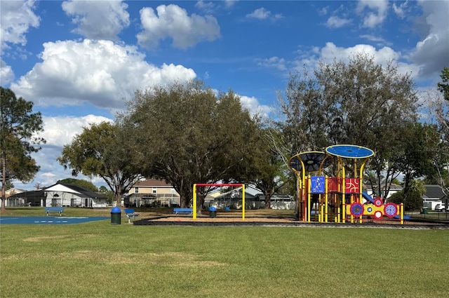 communal playground featuring a lawn