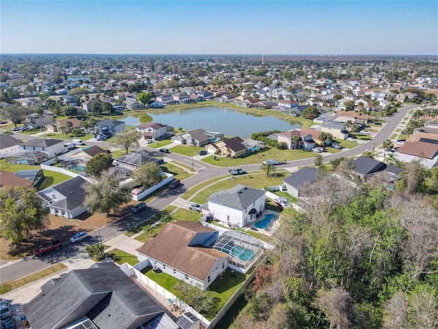 birds eye view of property with a water view and a residential view