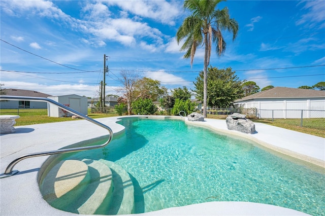 view of pool with a fenced in pool, fence, and a patio