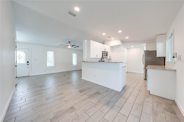 kitchen featuring recessed lighting, visible vents, appliances with stainless steel finishes, white cabinetry, and ceiling fan