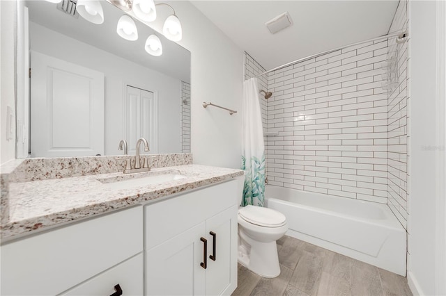 bathroom featuring shower / tub combo, vanity, toilet, and wood finished floors