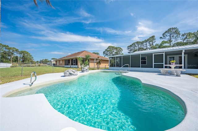 view of pool featuring a sunroom, a fenced in pool, fence, and a lawn