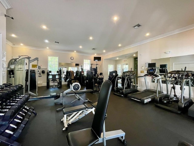 exercise room with visible vents, crown molding, and recessed lighting