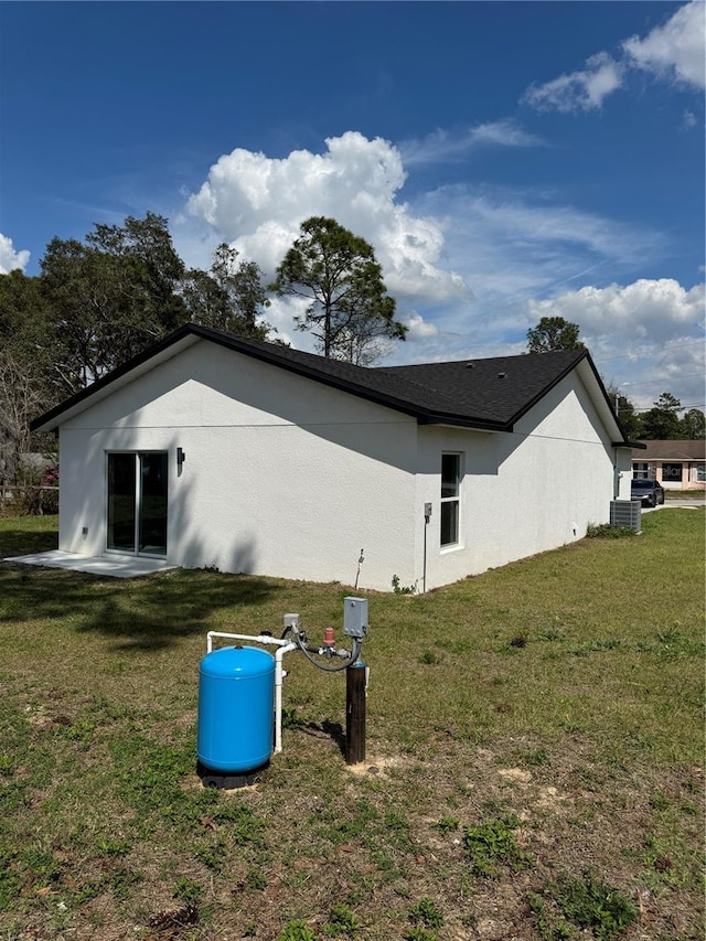 view of home's exterior featuring a yard and stucco siding