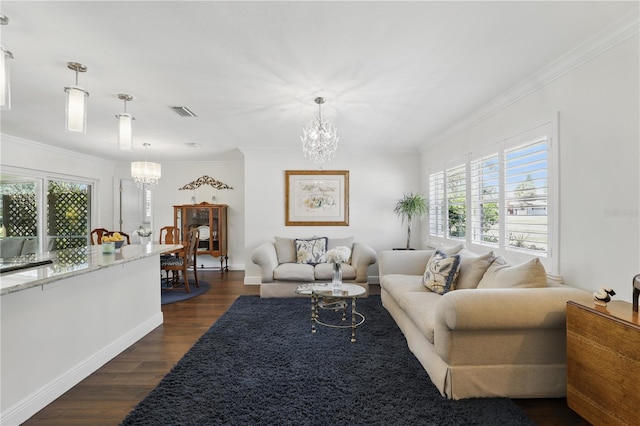 living area featuring crown molding, dark wood-style flooring, and a notable chandelier