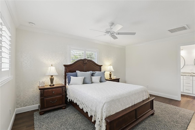 bedroom with baseboards, visible vents, dark wood finished floors, and crown molding